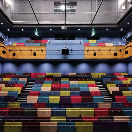 The brightly coloured seating bank of Lincoln Performing Arts Centre.